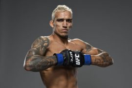 What happened to Charles Oliveira vs Max Holloway? How many UFC fights has Charles Oliveira won?