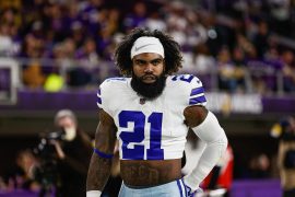 Why does Ezekiel Elliott wear a half shirt?