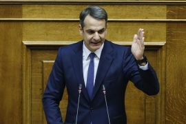 What languages does Mitsotakis speak?