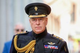 Why was Prince Andrew stripped of his military uniform?