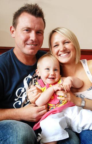 Joey Beauchamp, Millie Beauchamp, and their child