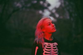 Why does Phoebe Bridgers wear a skeleton onesie?