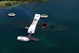 How many died on the Arizona at Pearl Harbor?