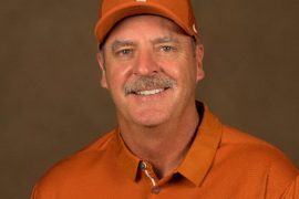 Who is the coach of Texas Longhorns softball team?