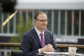 Where did Woj go to college? What is Adrian Woj job?