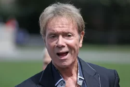 What is Cliff Richards most famous song? How many number 1 hits has Cliff Richard had?