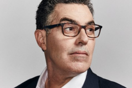 How did Adam Carolla get famous?