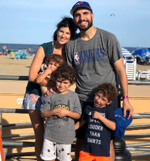 Ariel Helwani with his wife and three children