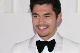 What is Henry Golding known for?