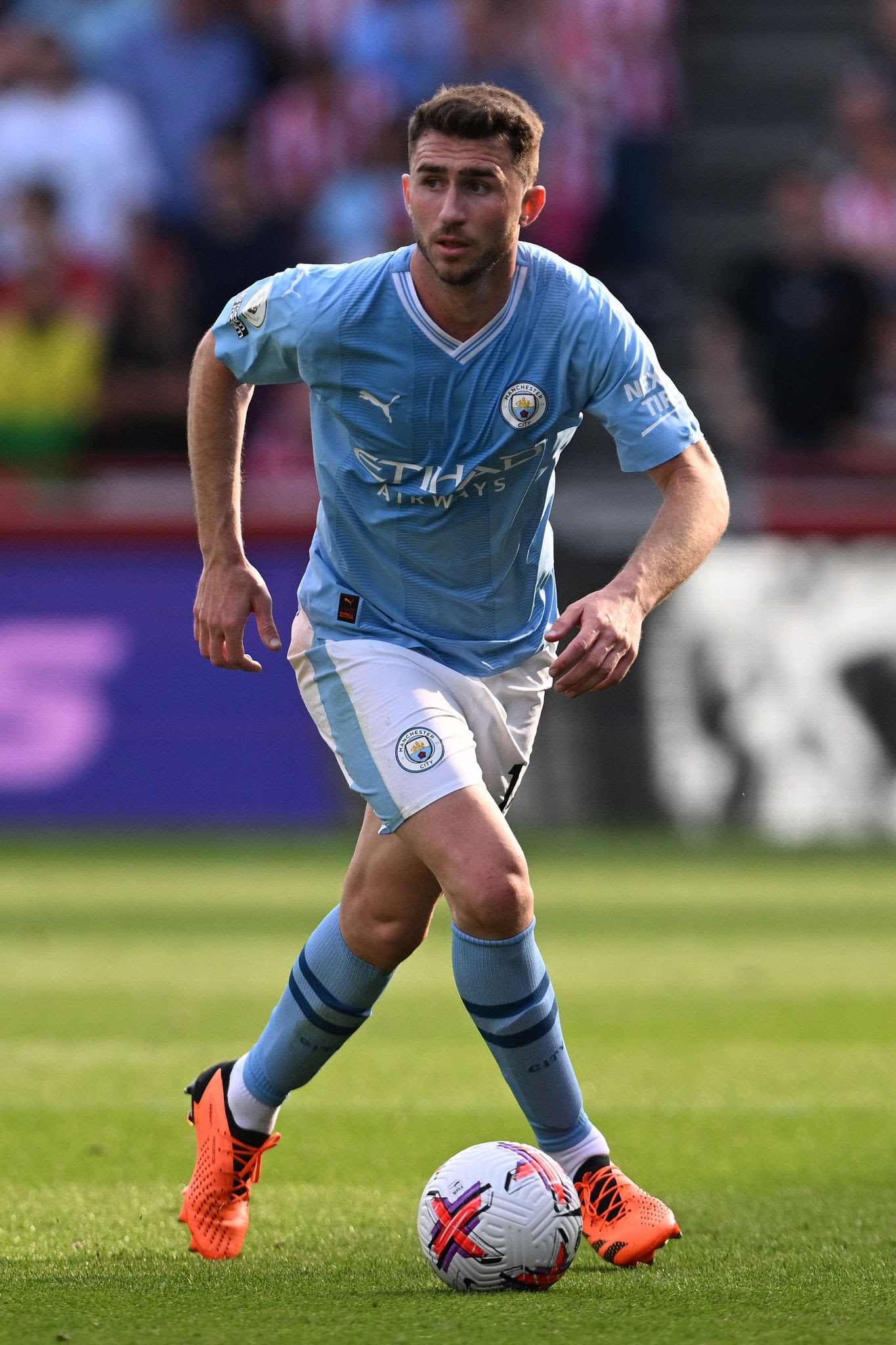 What languages does Aymeric Laporte speak? What nationality is Laporte originally?