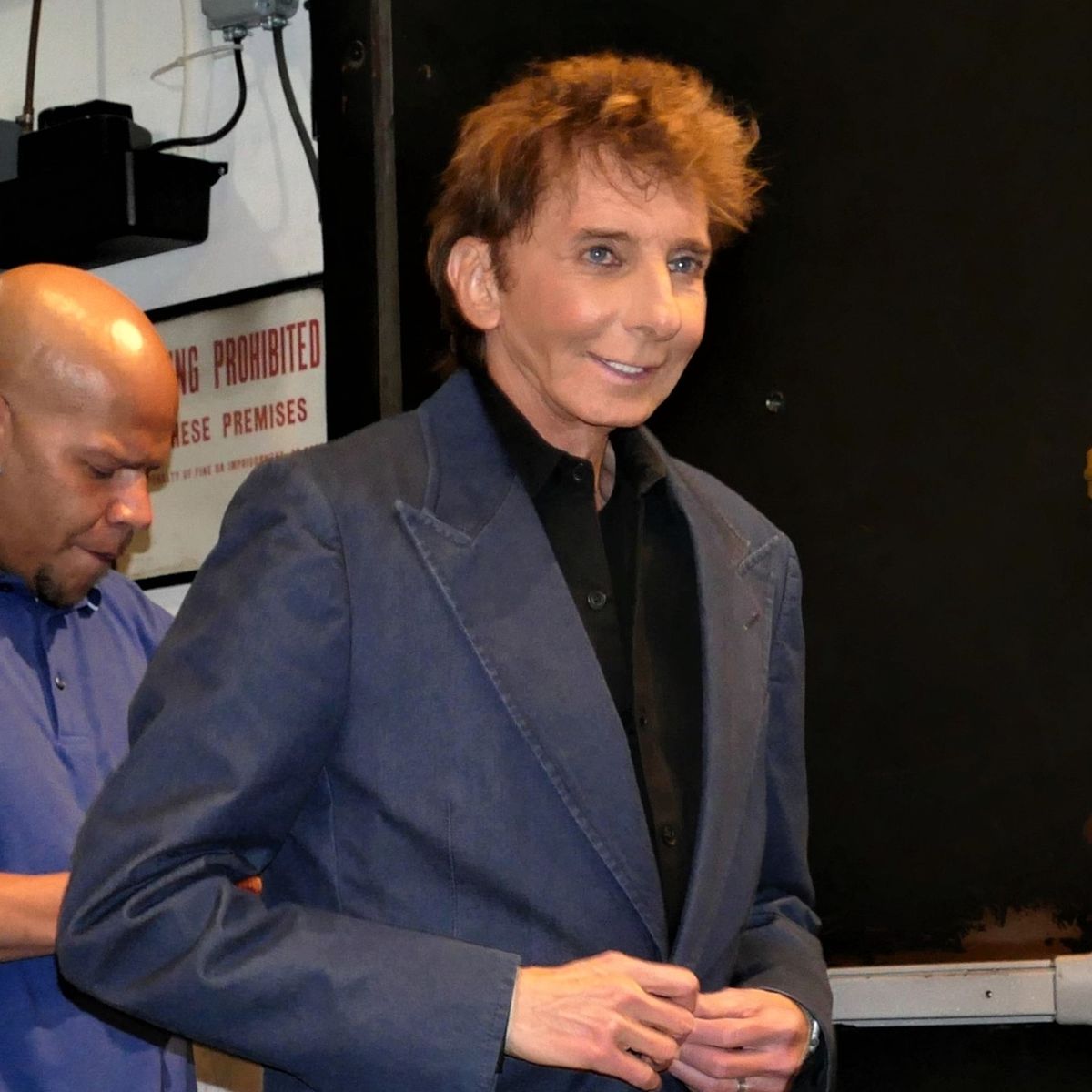Why is Barry Manilow famous? How many top 10 hits did Barry Manilow have?