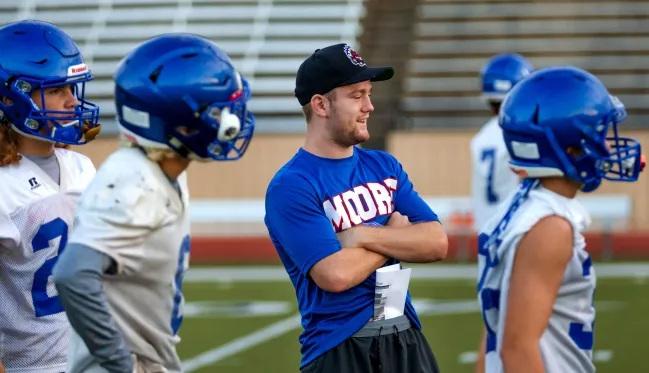 What does Isaac Stoops do? Did Isaac Stoops play football?