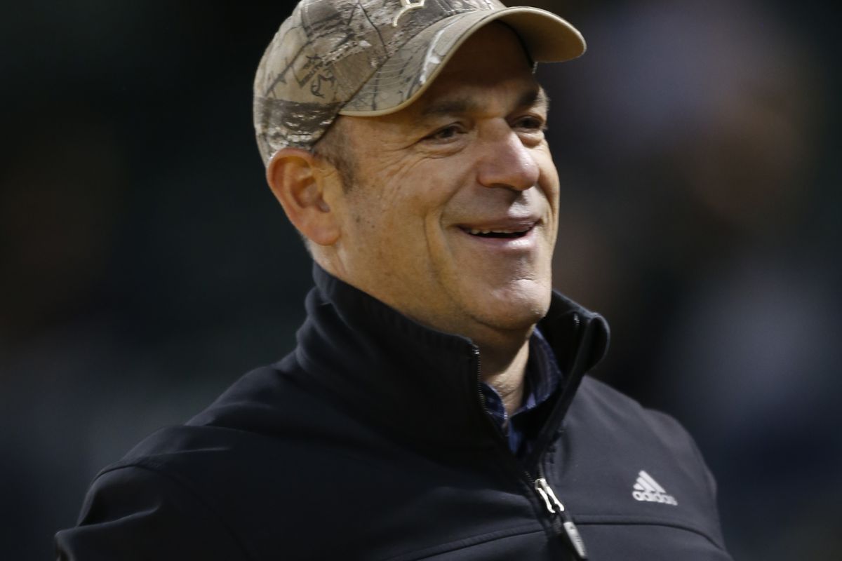 What companies does John Fisher (baseball owner) own?