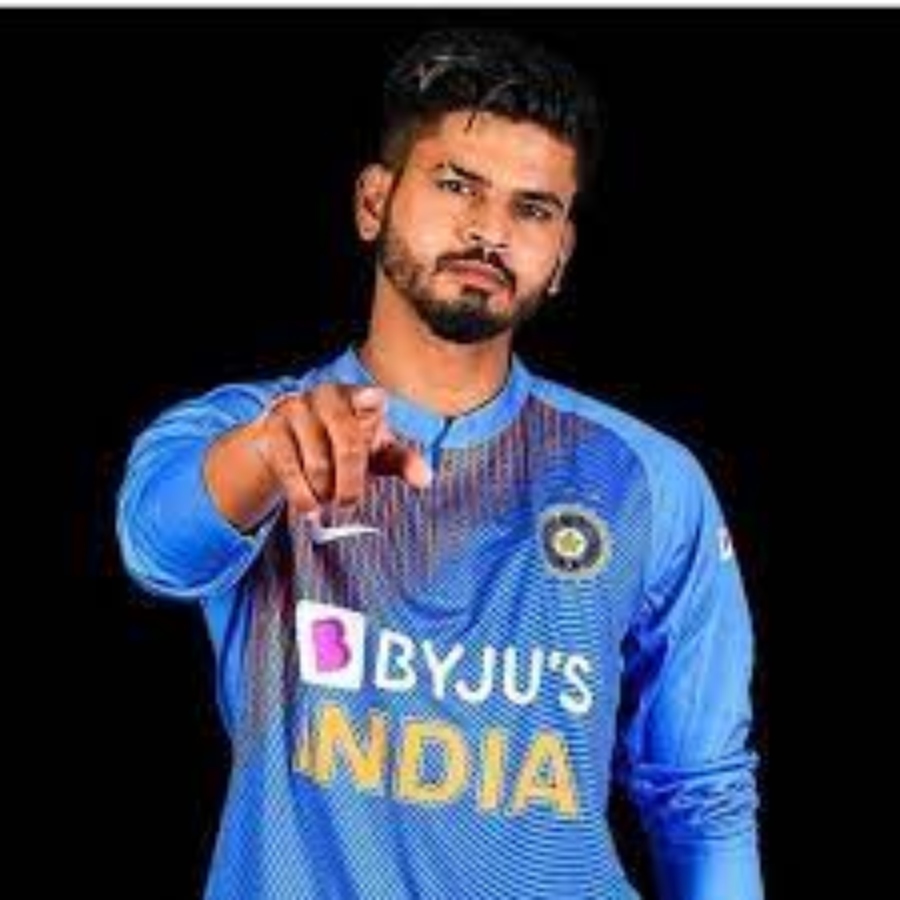 What does Shreyas have on his arm? What is Shreyas wearing on his arm?