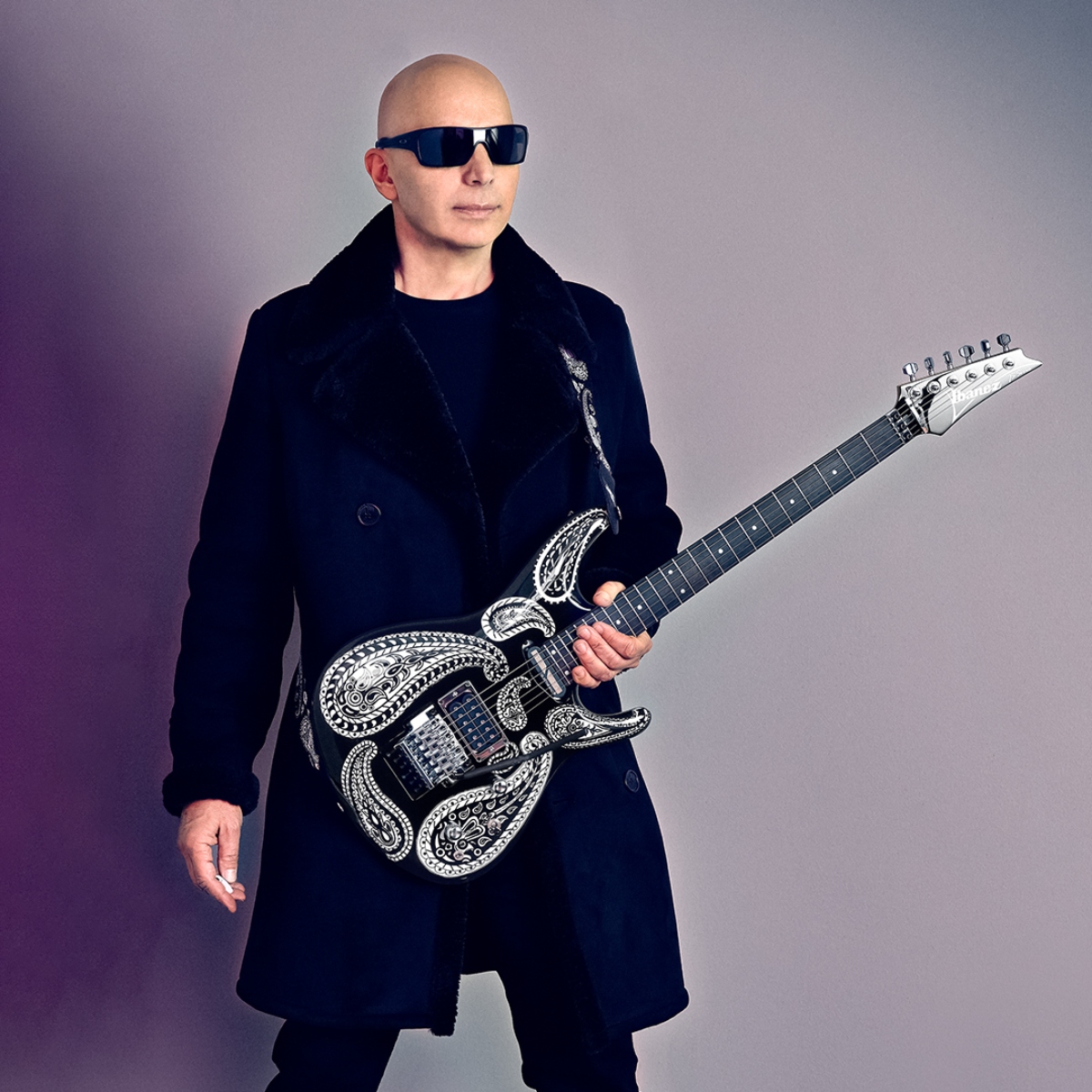 How did Steve Vai meet Joe Satriani? How long did Joe Satriani teach Steve Vai?