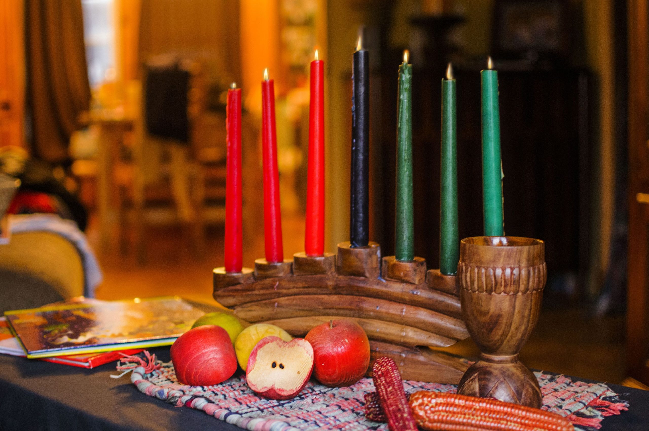 Which African language did Kwanzaa adopt? What is the correct greeting for Kwanzaa?