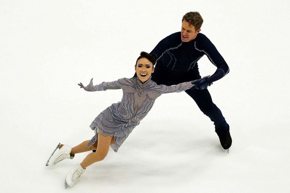 Who coaches Madison Chock and Evan Bates?