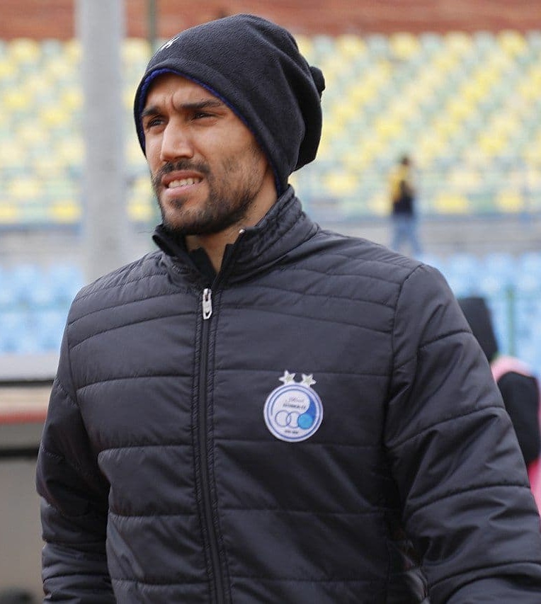 Iranian Goalkeeper Faces Controversy and Hefty Fine for Hugging Female Fan Without Hijab