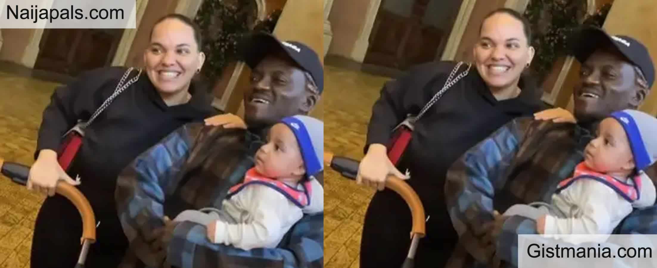 Portable Poses for Photo with Caucasian Lady, Holds Her Baby